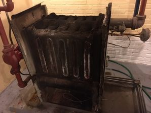70 Year Old Boiler Replacement in Chicago, IL

Before, During & After (2)
